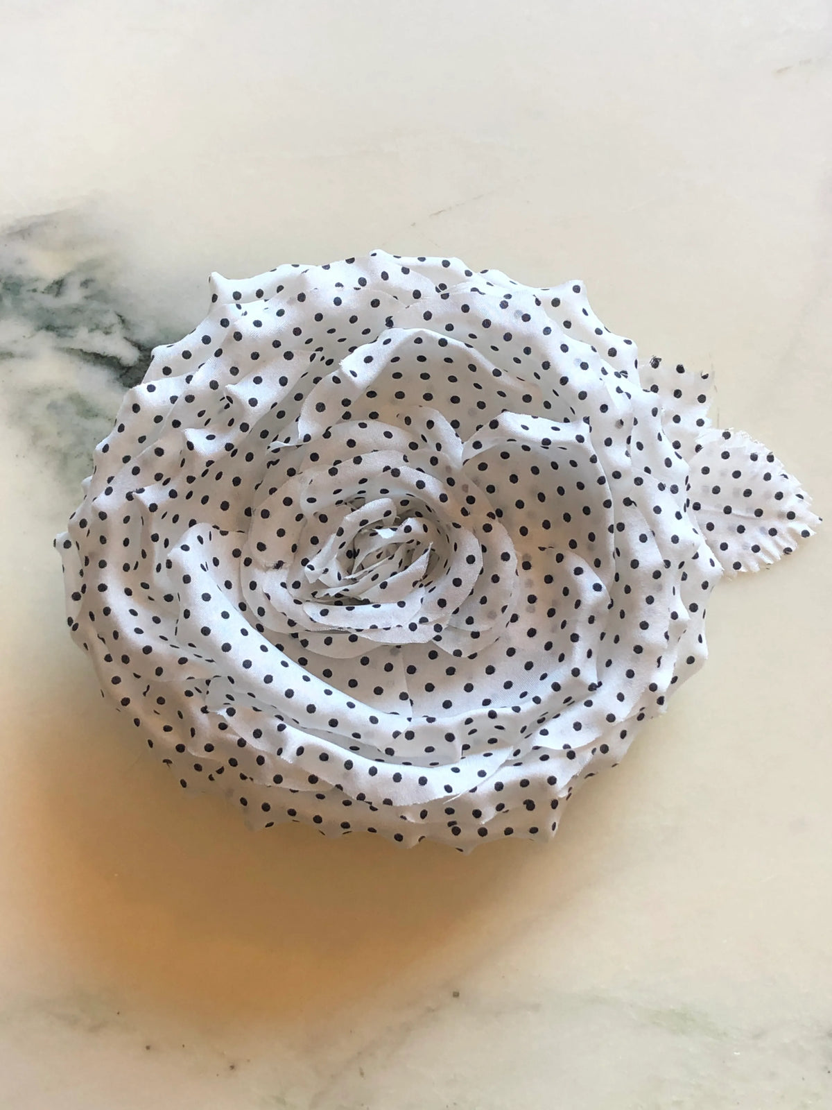 Broochella Dalmata Flower Brooch Pin in white with black polka dots, featuring sculpted layered fabric petals in a statement rose design.