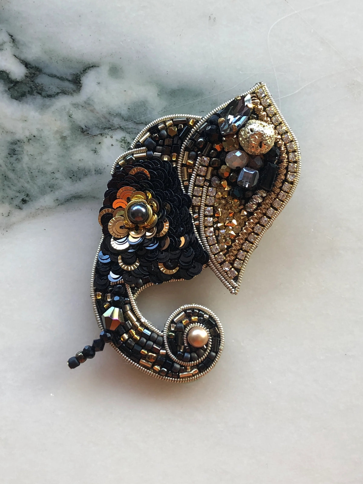 Broochella Elephant Brooch Pin hand-beaded in black, gold and bronze with sequins, crystals, rhinestones and pearl details.
