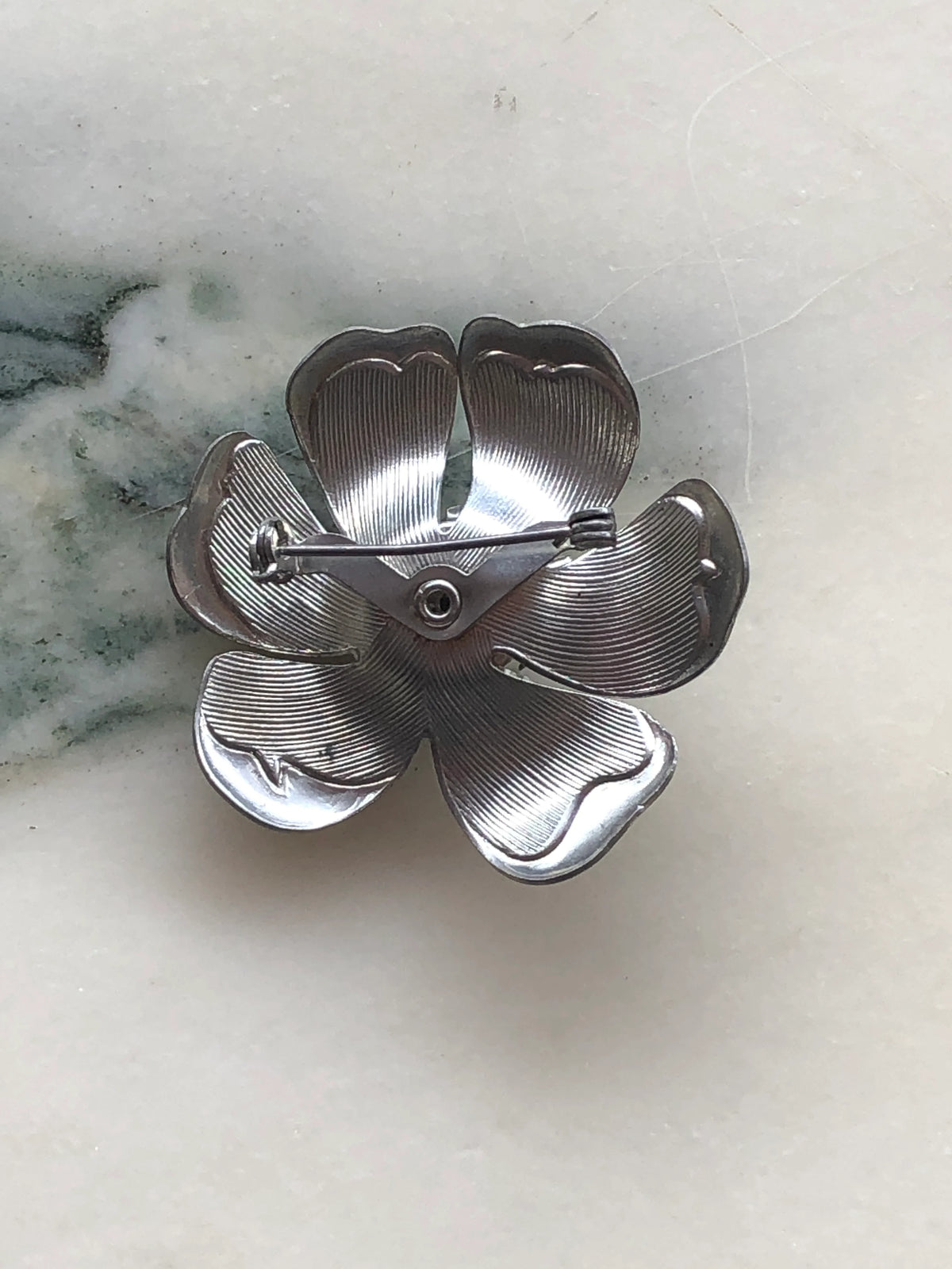 Broochella Fiore Viola Vintage Brooch back view showing the textured silver-tone floral construction and traditional pin fastening.