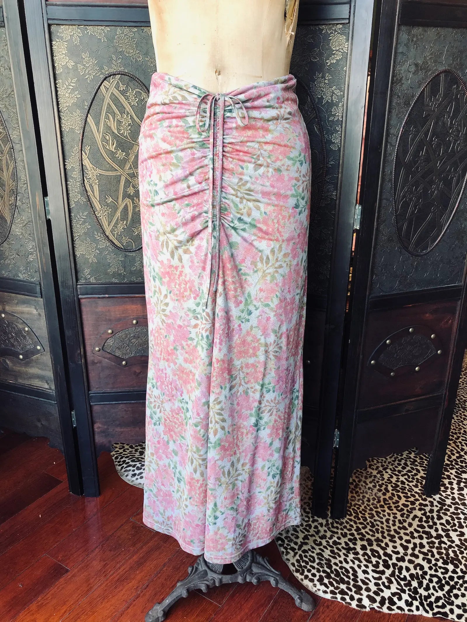 Broochella Hansel and Gretel metallic Floral pink skirt with centre front ruching on a mannequin against a decorative wall.