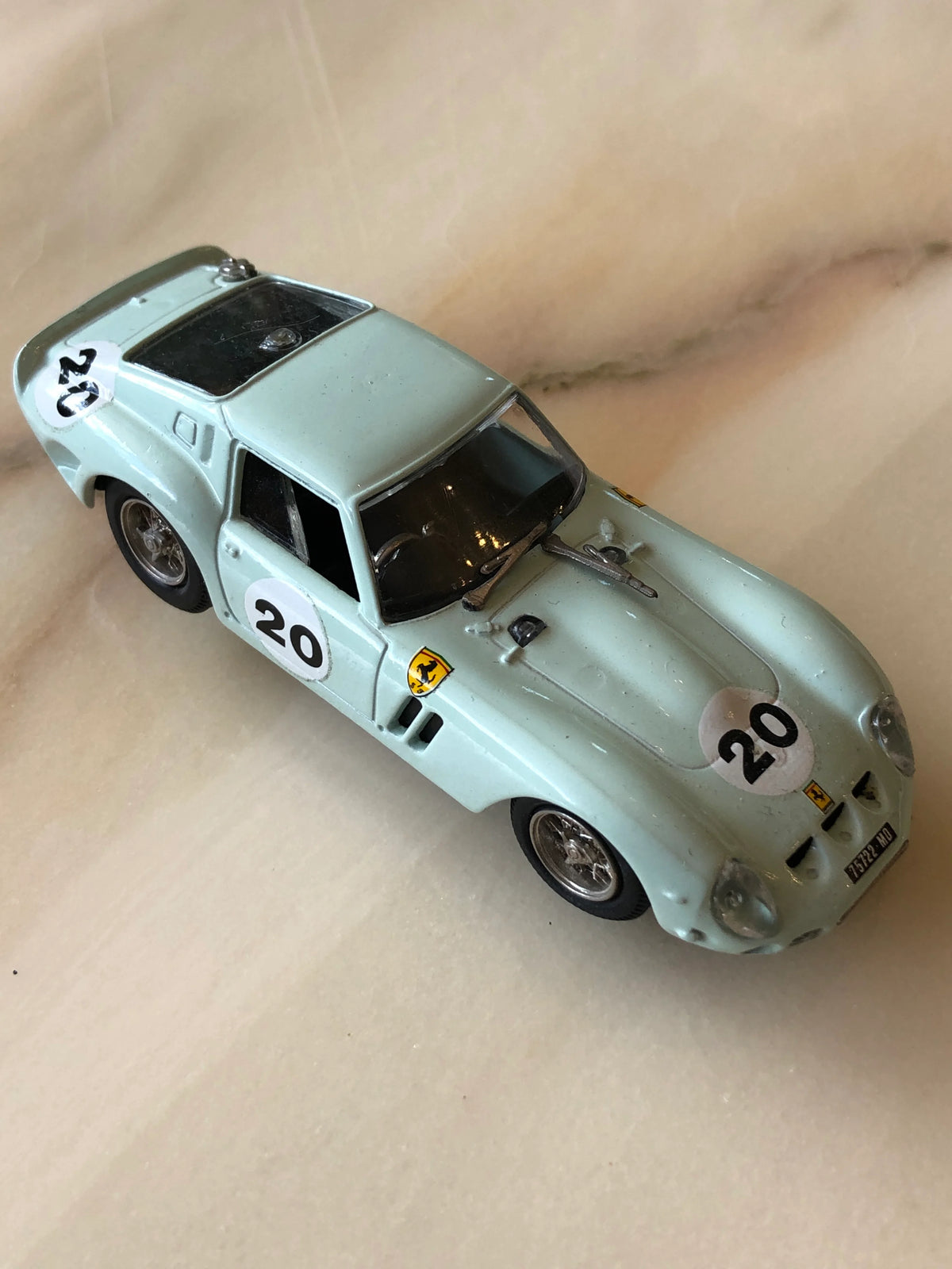 Broochella Men's Verde Acqua No.20 Vintage Ferrari Racing Car Brooch in pale aqua green, featuring number 20 racing decals, Ferrari emblems, silver wire-spoke wheels, black windows and classic Italian sports car detailing.