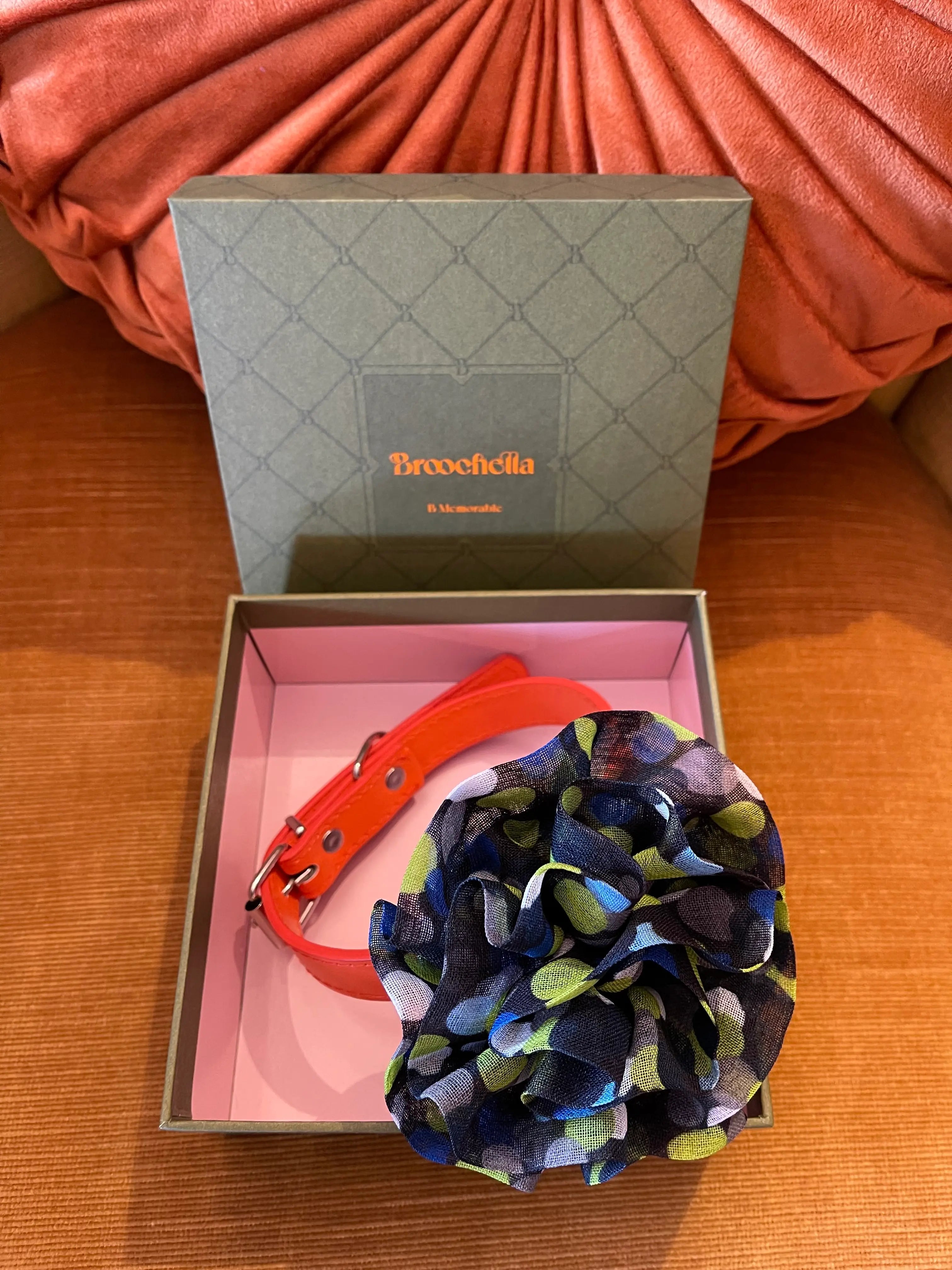 Broochella Poochella brassica flower pet collar in blue Pictured in a green box
